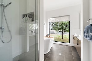Shower, hair dryer, towels, shampoo