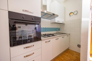 Fridge, oven, dining tables