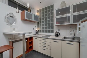 Fridge, microwave, stovetop, cookware/dishes/utensils