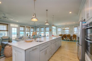 Fridge, microwave, oven, stovetop - Discover beachfront bliss at Starboard Side, Oak Island's spacious 4-bedroom retreat. (Oak Island)