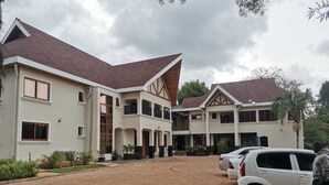 A large, multi-story building with a courtyard, featuring a mix of modern and traditional architectural elements. - HAVEN STAY HOTEL (Eldoret)