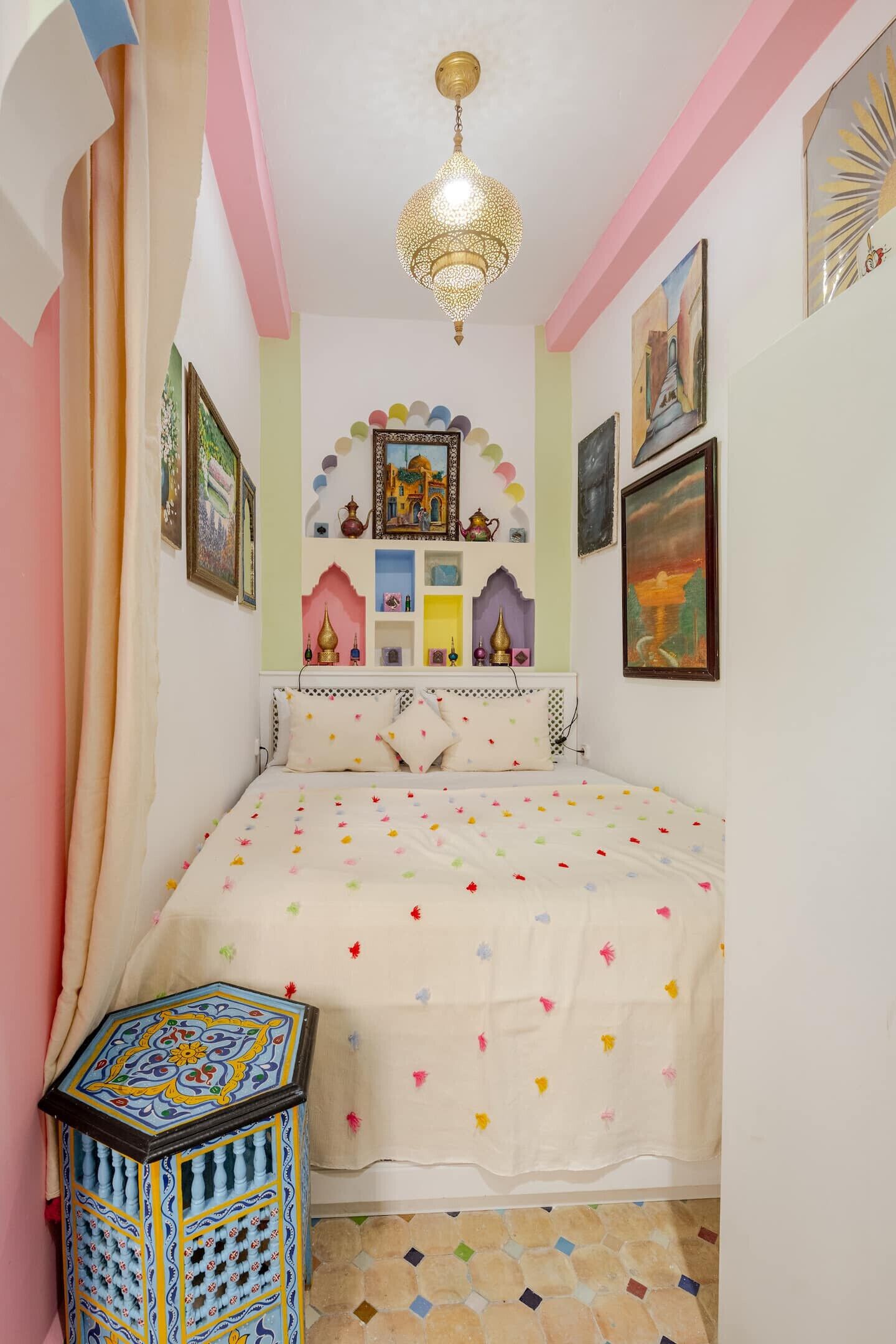 This inviting bedroom features a plush king-size bed, perfect for a relaxing stay in Tangier.