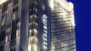 A modern building with a reflective facade and the name "ALVINTESA" prominently displayed.