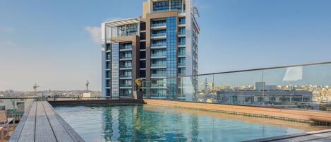 Indoor pool, seasonal outdoor pool, pool umbrellas, pool loungers