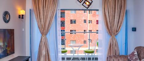 Classic Apartment | Living area | 55-inch Smart TV with cable channels, first-run movies