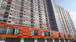 A high-rise building with multiple balconies and a colorful facade. - OYO 93906 Kingdom Property (Cikarang)