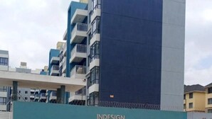 A modern building with balconies and a sign reading "Indesign Makumbi Park". - Apt 1 - 2BR Apartment with a pool, high-speed internet, close to the airport  (Nairobi)