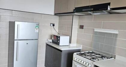 Apt 1 - 2BR Apartment with a pool, high-speed internet, close to the airport