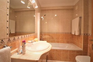 Apartment | Bathroom | Combined shower/tub, deep soaking tub, hair dryer, towels