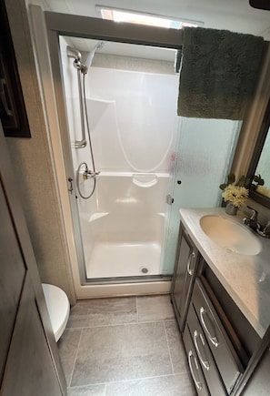 Shower, hair dryer, towels, soap
