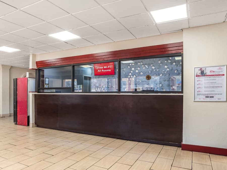 A reception area with a sign indicating free Wi-Fi in all rooms.