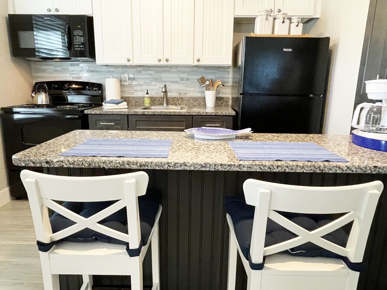 Granites counter with storage; full-size appliances
