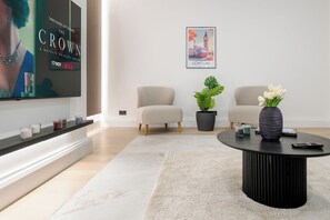 Luxury Apartment, 2 Bedrooms, Air conditioning | Living area | 75-inch Smart TV with digital channels