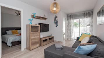 Comfort Apartment | Living area | 30-inch LED TV with digital channels