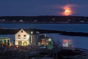 A waterfront property with a building labeled "Five Islands Lobster Co." and a dock with a boat.