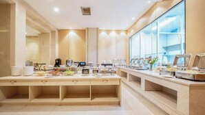A modern breakfast area with multiple counters, a large window, and a clean, minimalist design. - Vienna International Hotel (Chengdu)