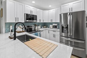 Coffee/tea maker, fridge, microwave, oven - Gorgeous water front condo in Madeira Beach (Madeira Beach)