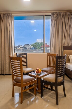 Deluxe Double Room | Living area | TV