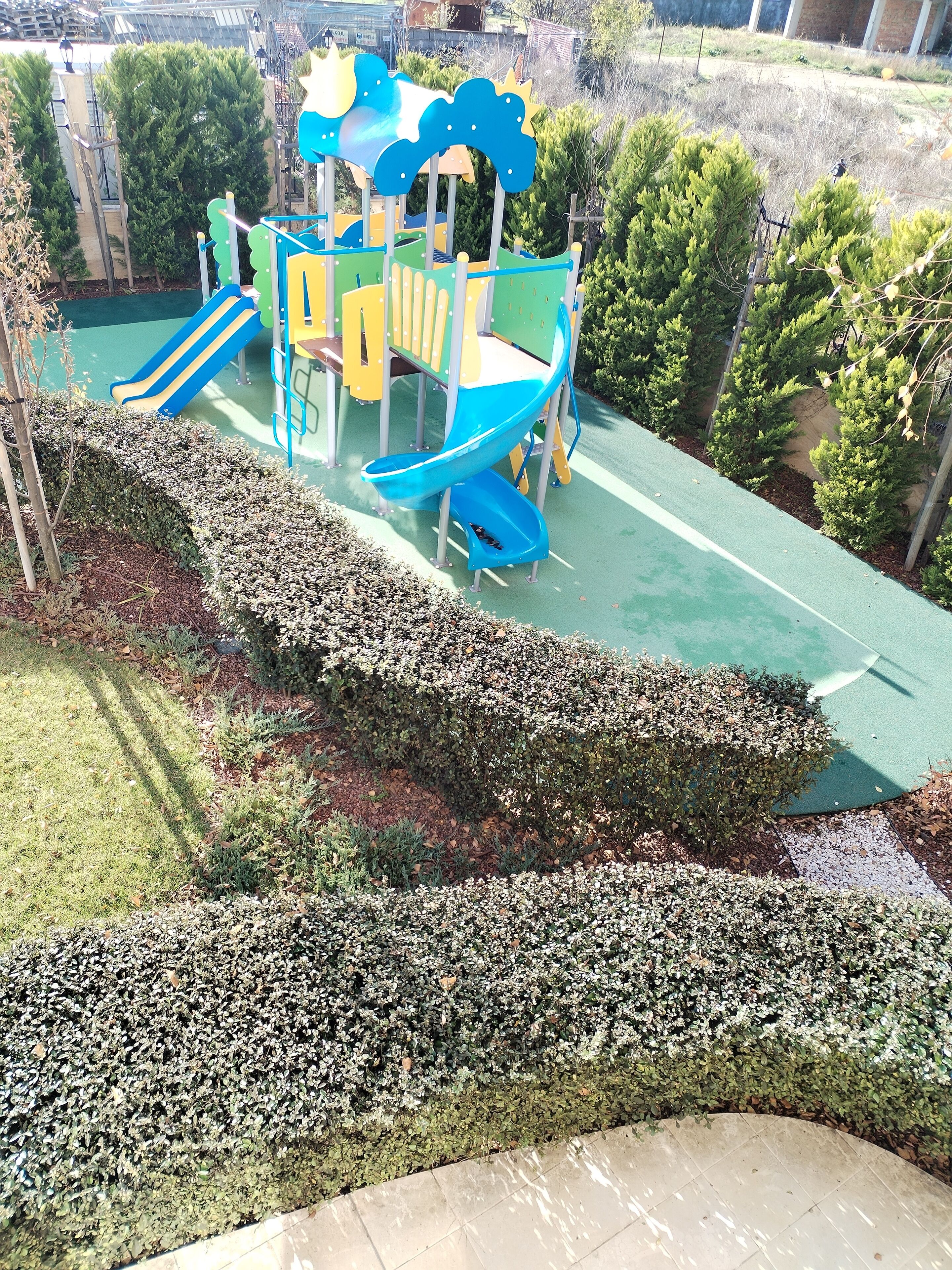 A playground with slides and climbing structures.