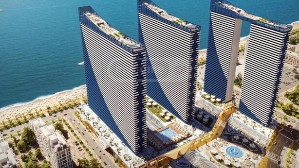 A high-rise building complex with a waterfront view, featuring multiple buildings with a modern architectural design. - orbi city 777 (Batumi)