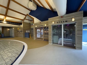 Relax by the pool, surrounded by a sauna and high ceilings.