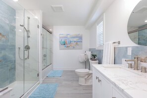 Shower, hair dryer, towels, soap
