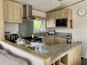 Fridge, microwave, oven, stovetop - Norfolk Lodge with private hot tub (Hoburne Holiday Park)
