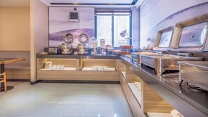 A modern breakfast bar with a wooden counter, stainless steel appliances, and a large window providing natural light. - Rest Comfort Hotel (Wenzhou Lucheng) (Wenzhou)