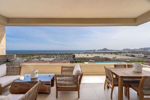 Outdoor dining - Vista Vela II 2307 Spectacular New 2BR Condo with BBQ and Ocean views (Cabo San Lucas)