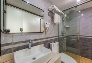 A bathroom with a large mirror, a sink, a glass shower enclosure, and a towel rack. - Century Business Hotel (Zuoling New Town) (Wuhan)