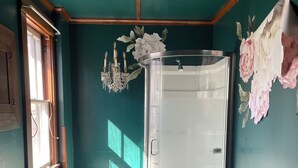 A bathroom with a glass shower, a toilet, and a bathtub. - Historic Carriage House Suite (Mannington)