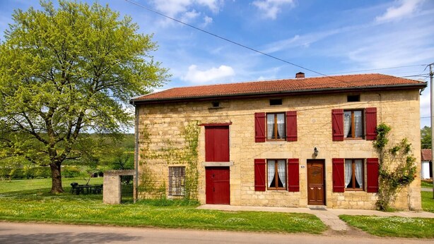 A two-story stone building with red shutters, a tiled roof, and a small front porch. - LA MADELEINE - MALANDRY (MALANDRY)