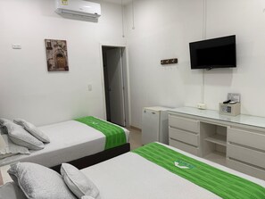 Basic Quadruple Room, 2 Queen Beds | Down duvets, in-room safe, individually decorated, desk - Insitu Recovery Hotel (Cali)