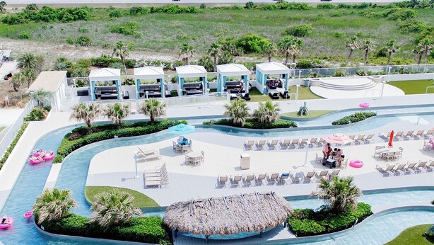 A resort with a large pool area, lounge chairs, and a view of the ocean. - DOWN BY THE BAY! ASK ABOUT DISCOUNTS! 3 bed 3 bath Gulf facing unit!  (Orange Beach)