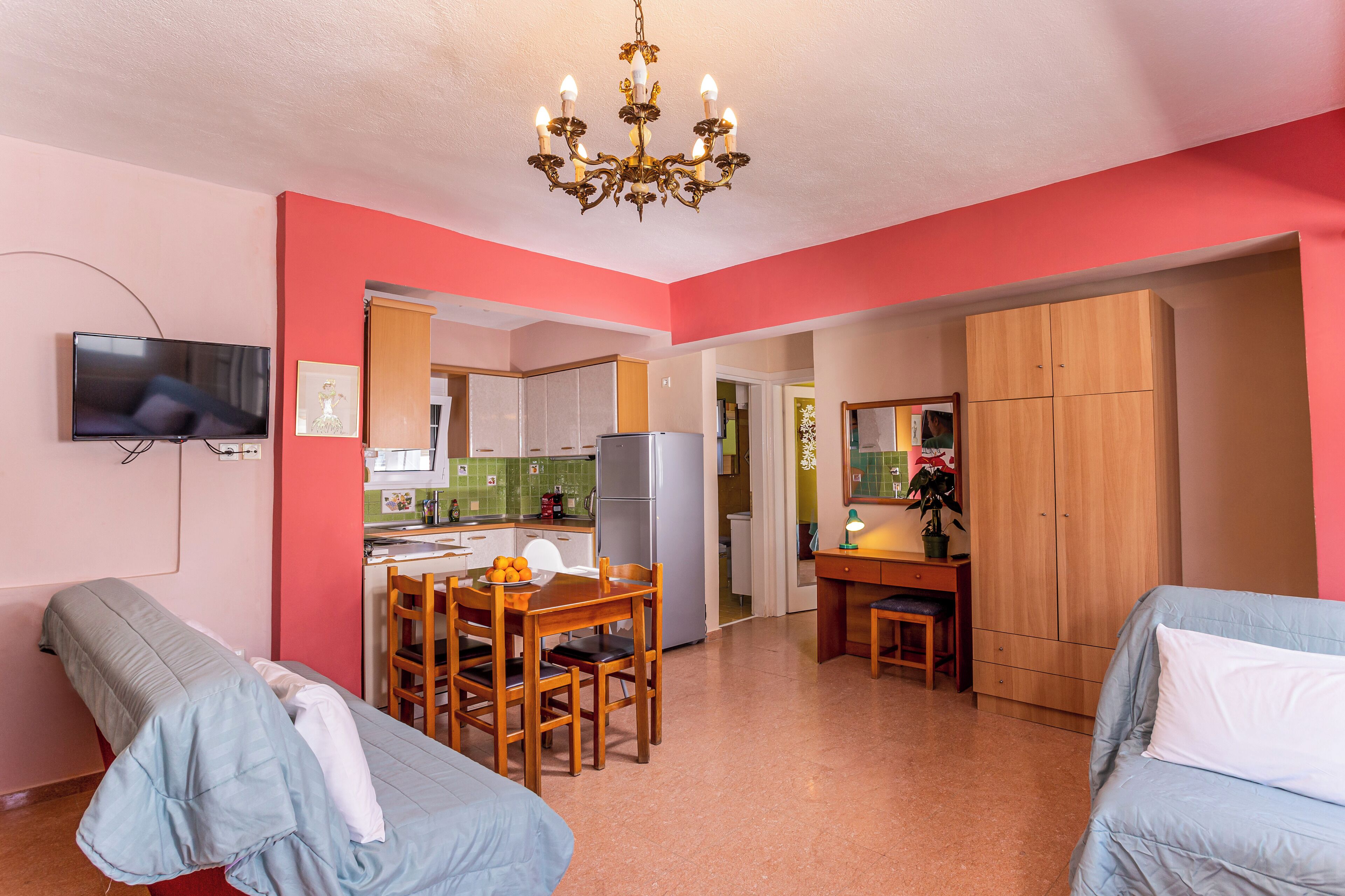 Deluxe Suite, Balcony, Pool View | Living area | LCD TV