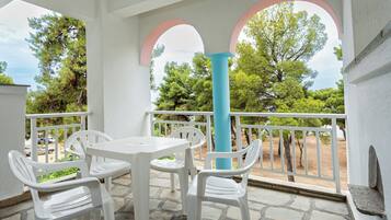 Standard Double Room, Garden View | Balcony view
