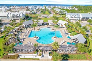 A resort with a central swimming pool, lounge areas, and a view of the ocean. - Relax Away on 30A by Stay on 30a (Inlet Beach)