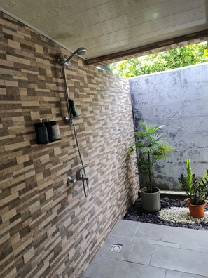Shower, hair dryer, towels, soap