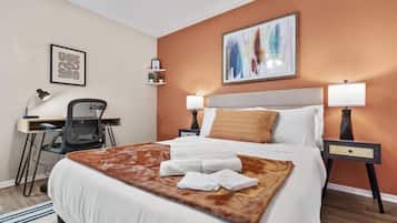 1 bedroom, desk, iron/ironing board, travel crib