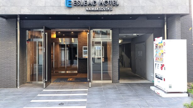 The Eslead Hotel entrance with a modern design, including a glass door and a visible reception area. - ESLEAD HOTEL Namba South 2 (Osaka)