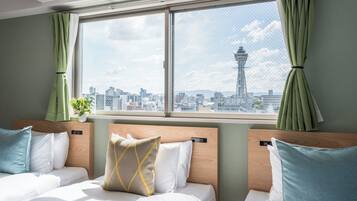 Premium Quadruple Room, City View | Premium bedding, blackout curtains, free WiFi, bed sheets