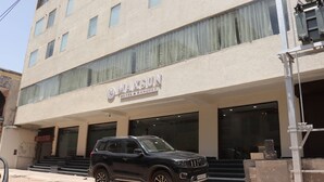 A building with a sign reading "MAXSUN HOTEL & BANQUET". - Hotel Maxsun Gwalior (Gwalior)