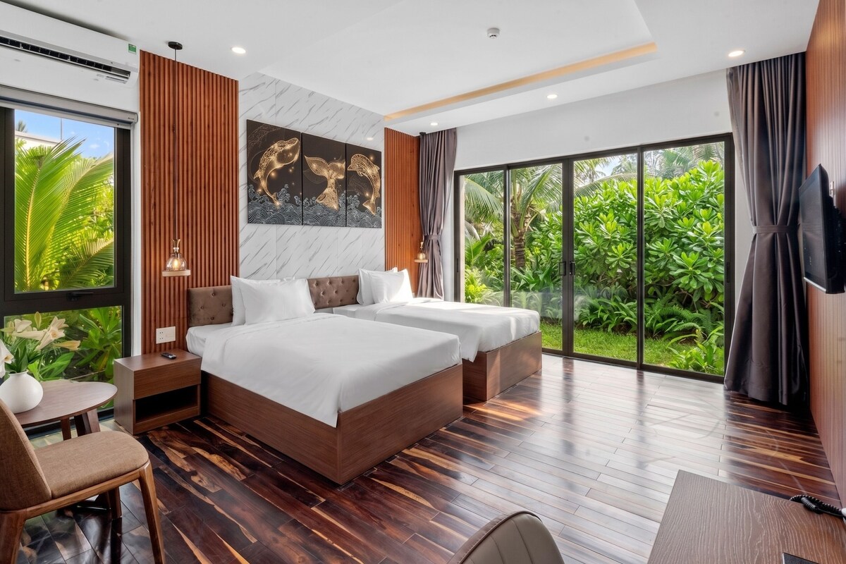 Luxe beddengoed, een minibar, een kluis op de kamer, een bureau