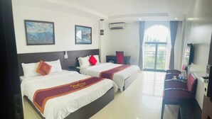 A hotel room with two beds, a dining area, and a balcony with a view. - Sapa Crown Hotel (Sa Pa)