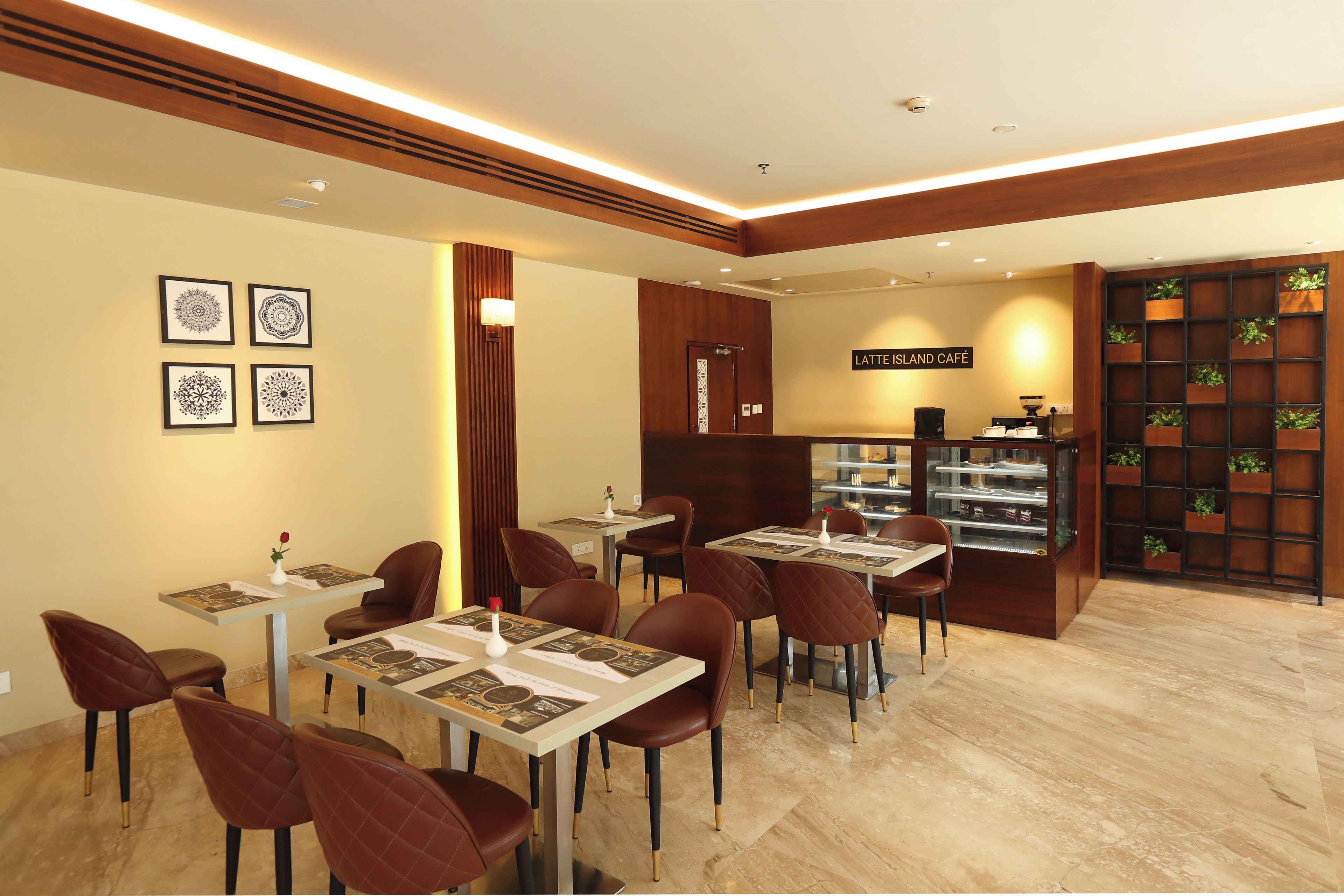 A modern cafe with wooden accents, a coffee bar, and a menu display.