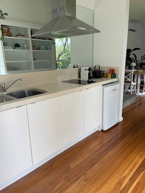 Fridge, microwave, stovetop, coffee/tea maker