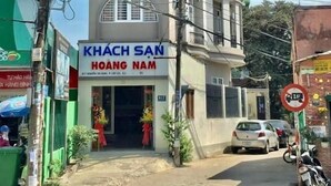 A multi-story building with a sign for "KHACH SAN HOANG NAM" and a date "HOAG 23/3/2017". - Hoang Nam Hotel Q2 SG- by Bay Luxury (Ho Chi Minh City)