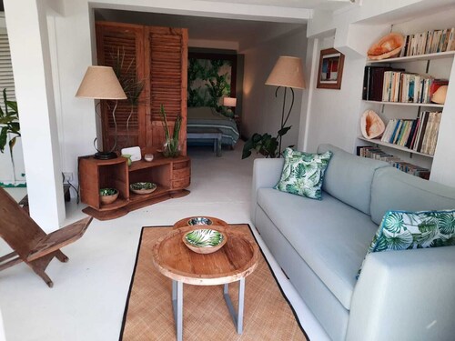 Adorable and spacious independent studio on garden level with patio.