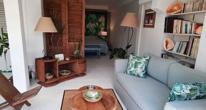 Adorable and spacious independent studio on garden level with patio.