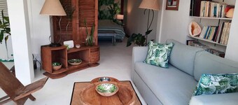 Adorable and spacious independent studio on garden level with patio.